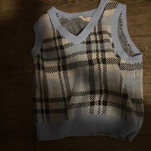 It’s a blue top with patterns of black/white/ blue and it’s in excellent conditi